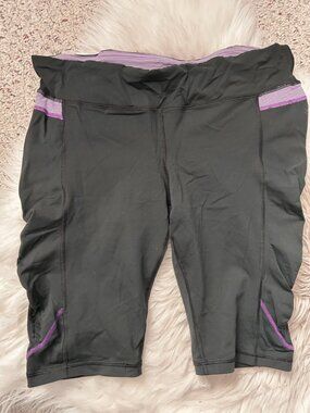 Lululemon Black Short Capris with Purple and White Striped Accents 12